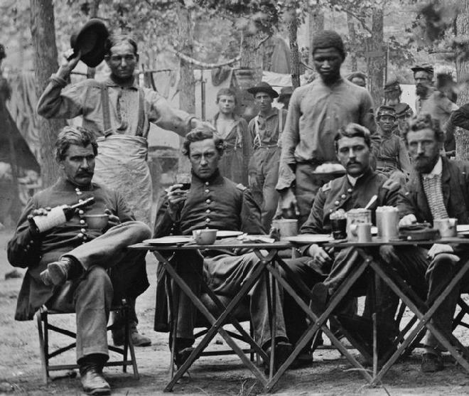 Here are Officers of Co. F, 93rd New York Infantry having dinner at Bealton, Virginia. Again notice the size and shapes of their cups. 