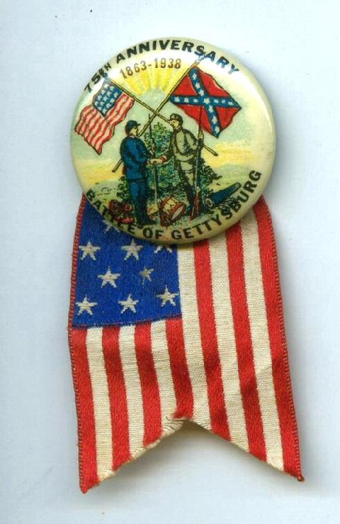 Beautifully Preserved Celluloid Pinback with Original Paper Label & Flag Ribbon From the 1938 Blue & Gray Reunion at the 75th Anniversary of the Battle of Gettysburg, Pennsylvania.