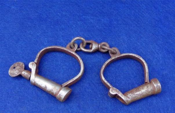 Fine Pair of Early Hiatt Marked Handcuffs with Key