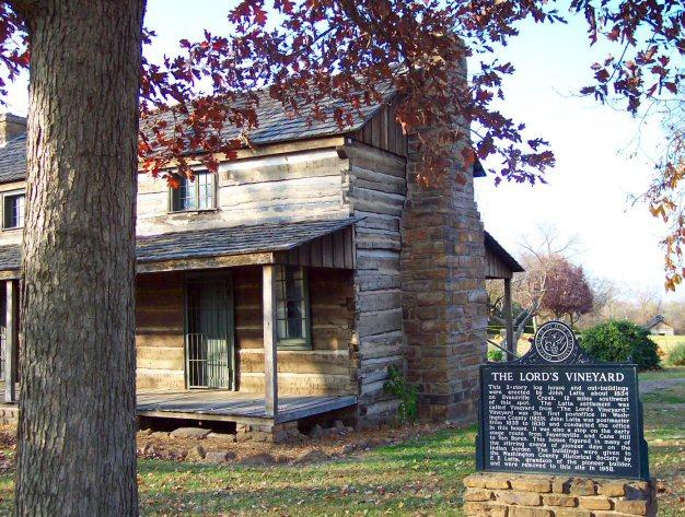 Marker on the east end of the Log Latta House.