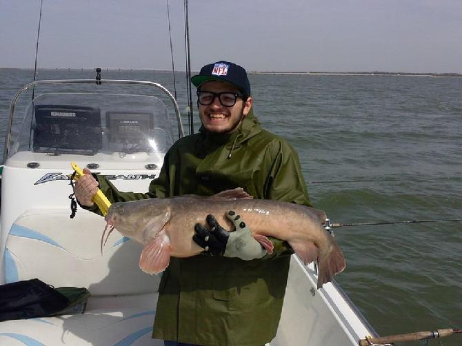 Max Burgess with his 35 pound flathead catfish after finally landing it ! Man, what a prize ! I'm not sure I could have got either one of these boys fish to the boat without breaking my line. 