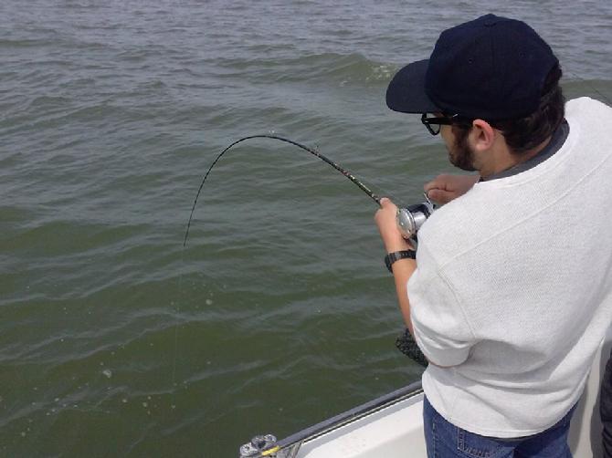 Maximilian Burgess fights to bring his own monster catfish in, likely wondering all the time, " What the heck is it ?" 