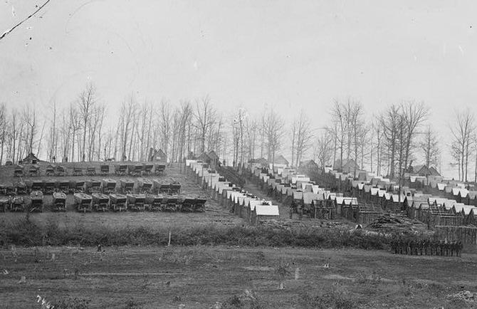 Winter Quarters on the Rhappahannock River, Virginia, of the 50th New York Engineers, with Pontoons in the left of the photograph. 